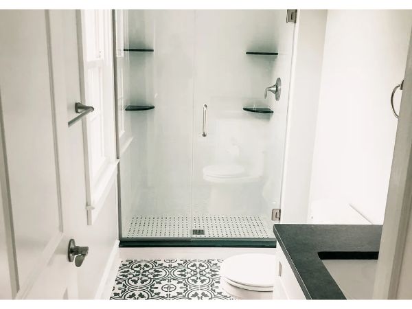 New shower remodel with modern design and built-in shelves