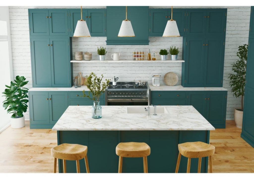 White walled kitchen with seafoam green cabinets