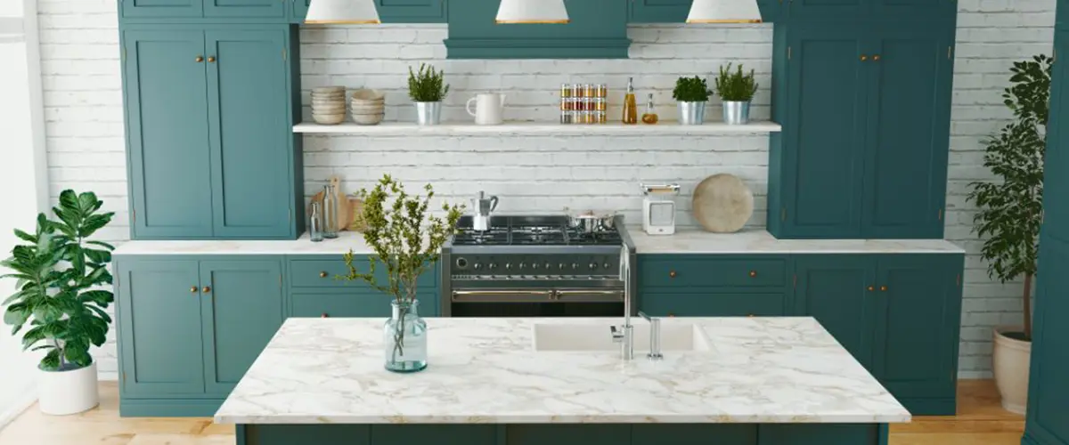 white walled kitchen with seafoam green cabinets