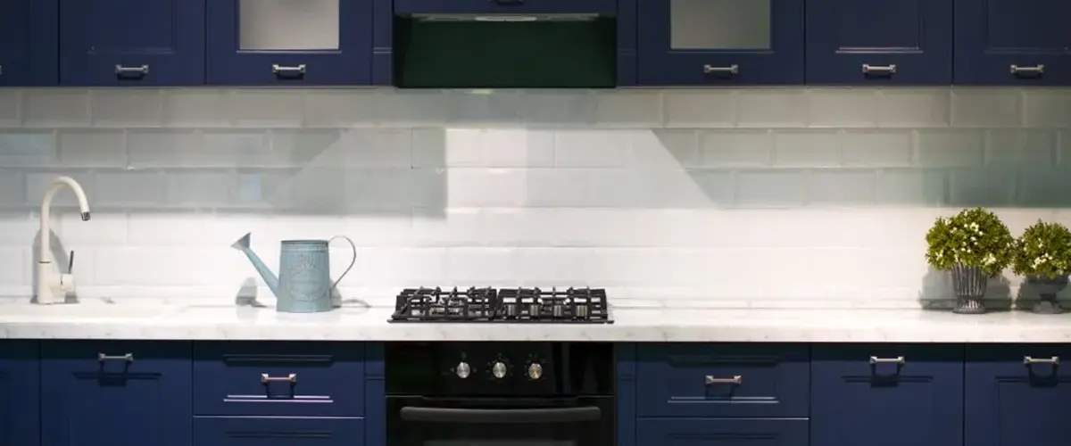 dark blue and white kitchen cabinets