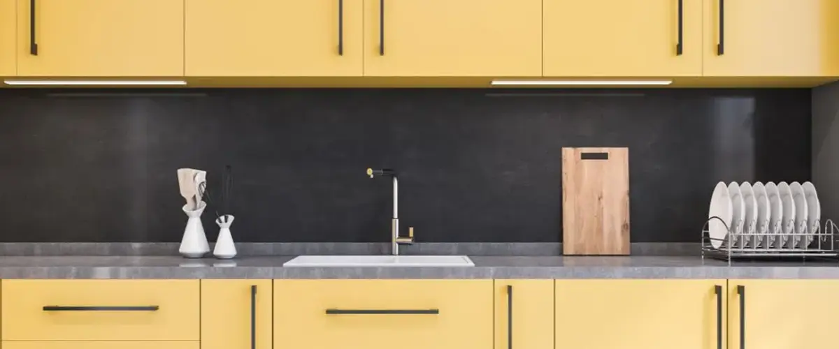 light yellow and black kitchen cabinets