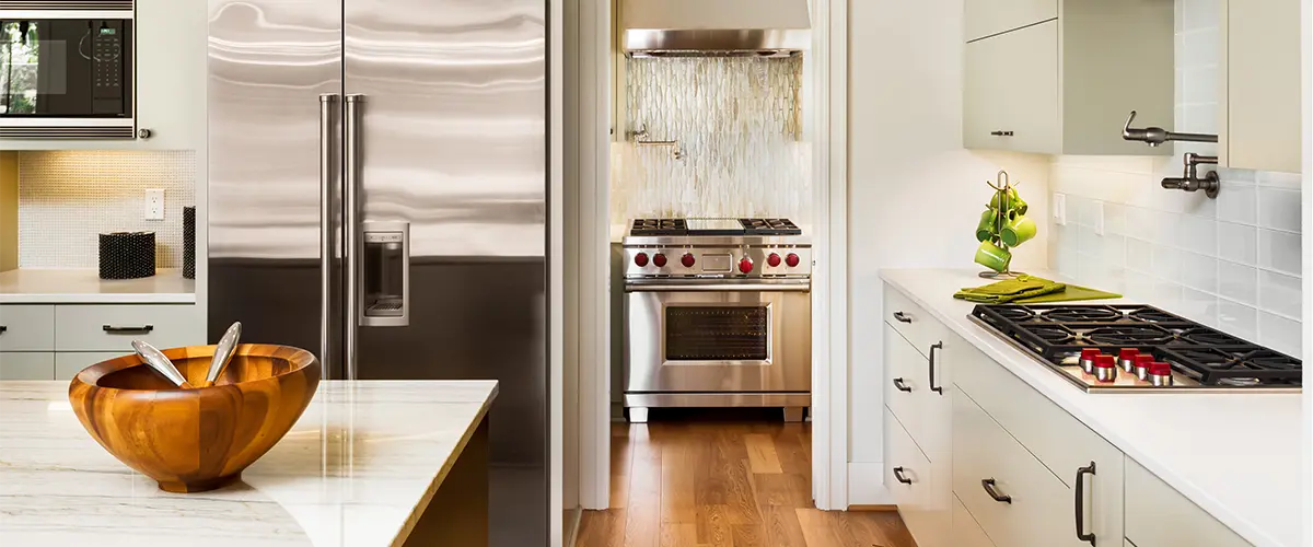 A kitchen range, a fridge, and a stove in a remodeled kitchen