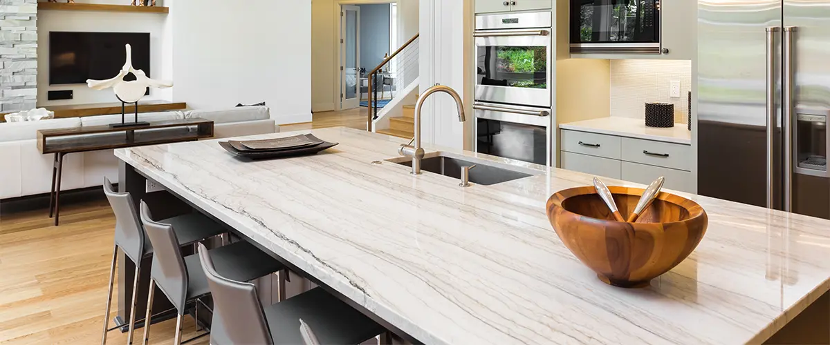 Quartz countertop with veins and a wooden bowl