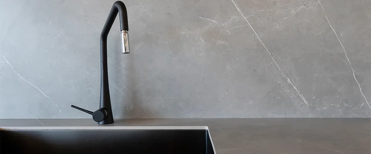 Concrete countertop with black faucet