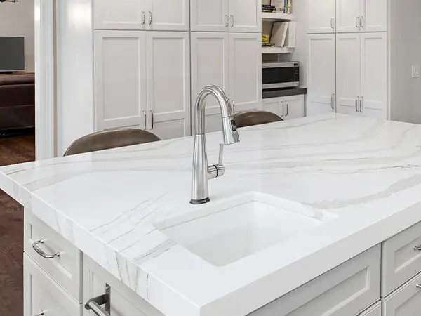 Marble countertop on an island with a silver faucet
