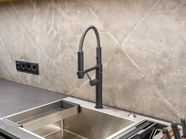 An extendable kitchen faucet and a drop-in sink