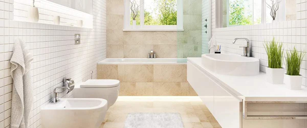 A bathroom with tile granite floor and shower surround