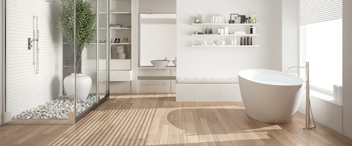 Wood bathroom flooring with freestanding tub and shower