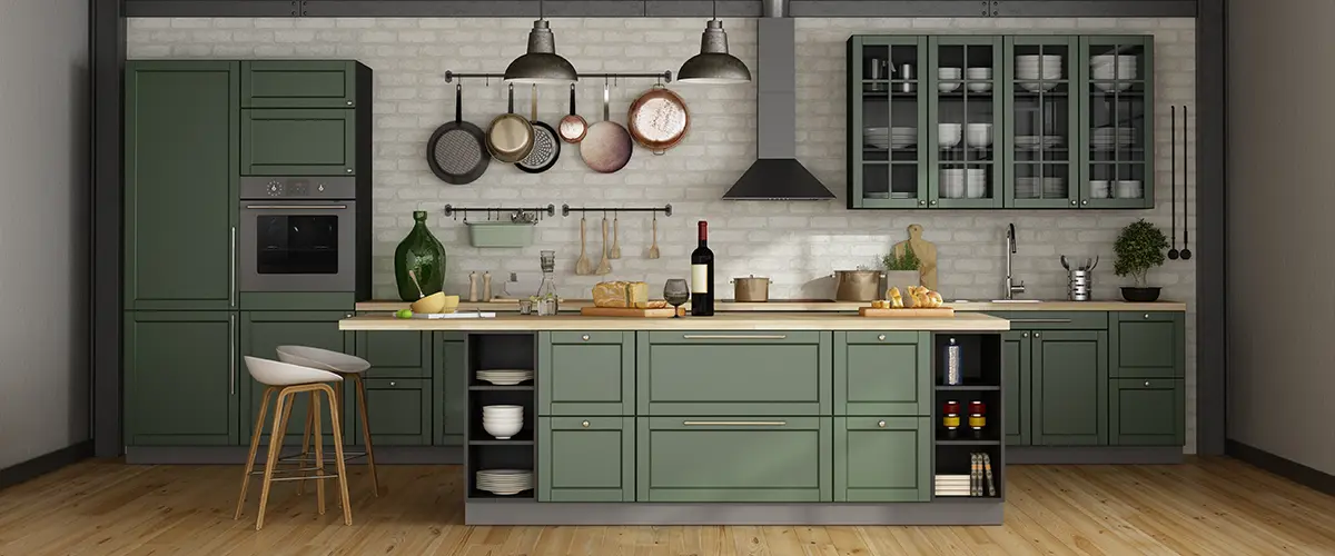 A kitchen remodel with green cabinets in a modern space