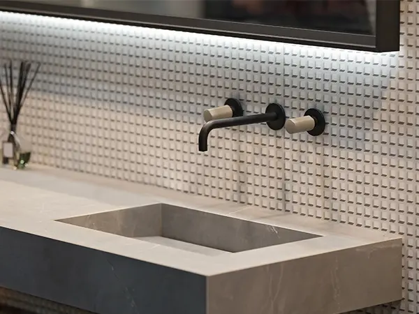 Concrete countertops with black faucet