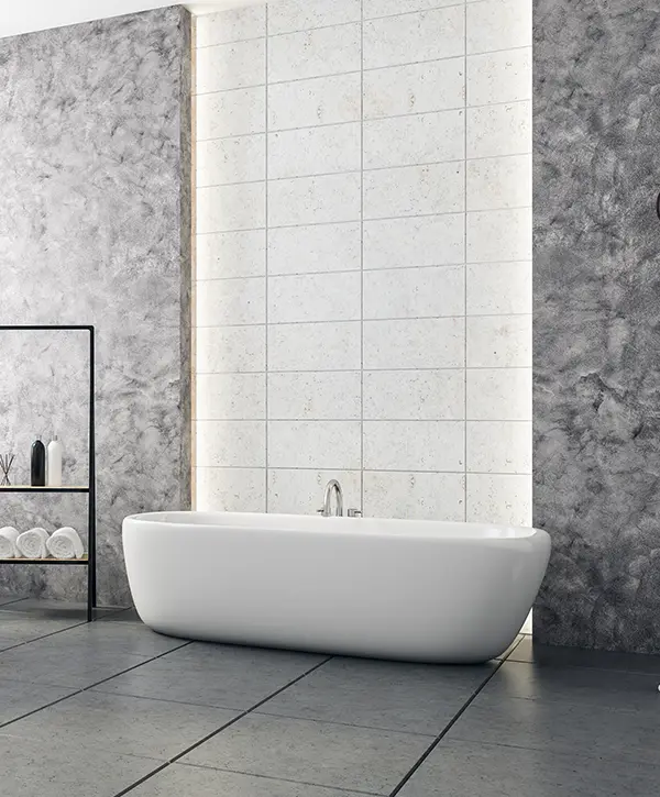 Freestanding tub with dark walls and tile floors