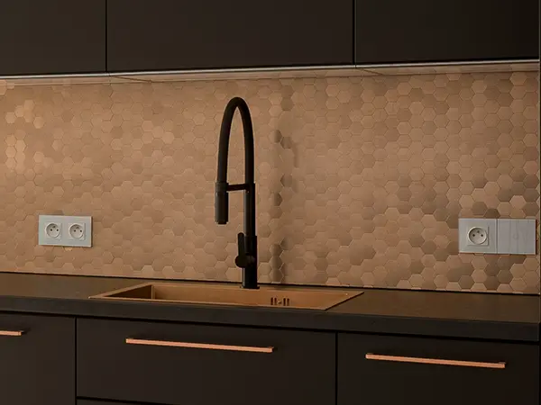dark kitchen sink with penny tiles backsplash