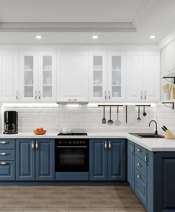 Blue base cabinets and white upper cabinets in a kitchen with dark accent colors