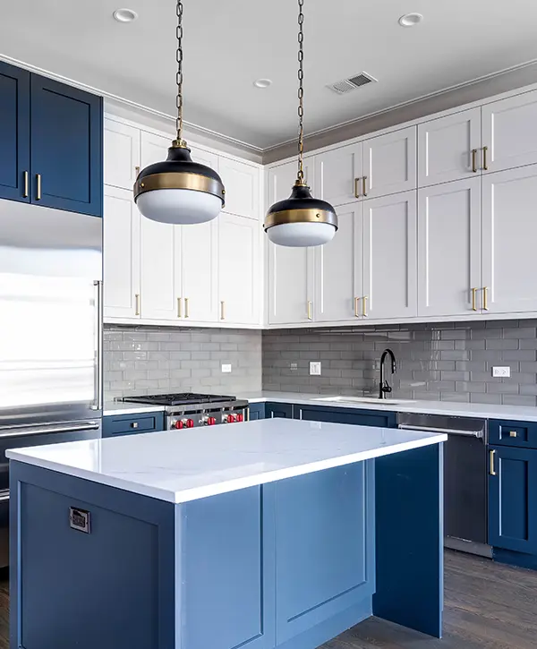 Blue cabinets and kitchen island in a white kitchen