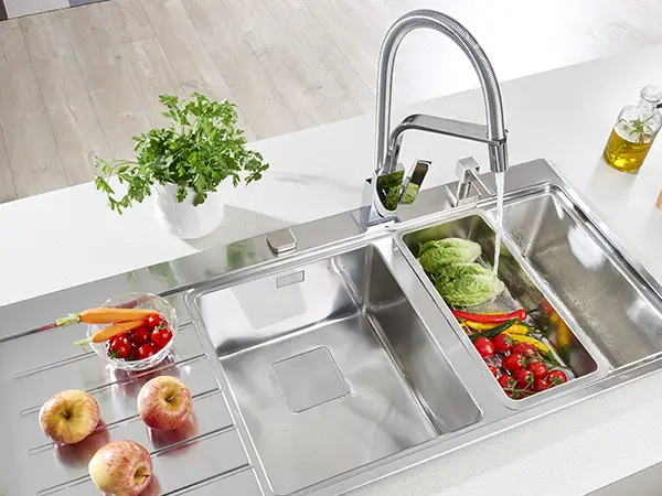 stainless steel drop-in sink with fruits