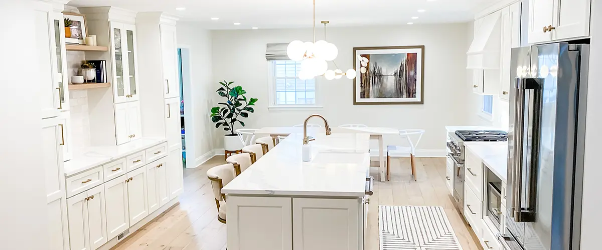 White kitchen with white cabinets and a clean quartz countertop