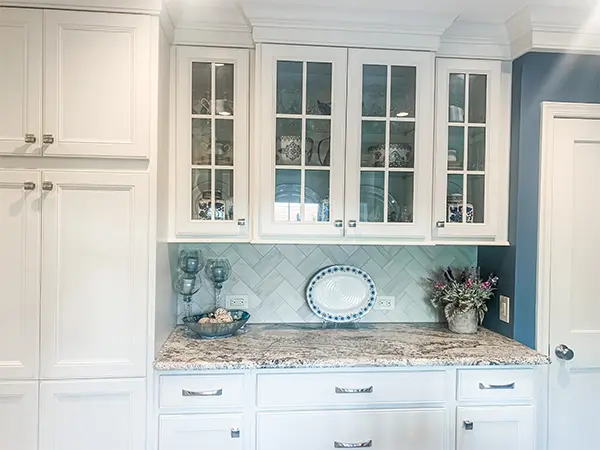 White kitchen cabinets with glass doors