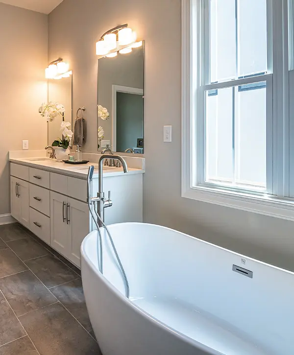 A freestanding tub and a vanity in a bathroom remodel in Media