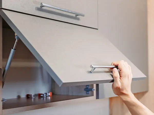 Kitchen cabinets with a pull up shelf