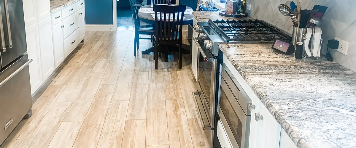 Wood flooring and granite countertop in kitchen remodel in Media