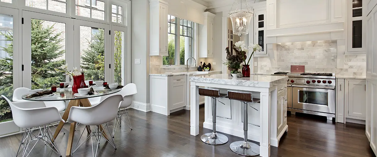 A kitchen remodel cost in Media for an open space kitchen with a small island and wood flooring