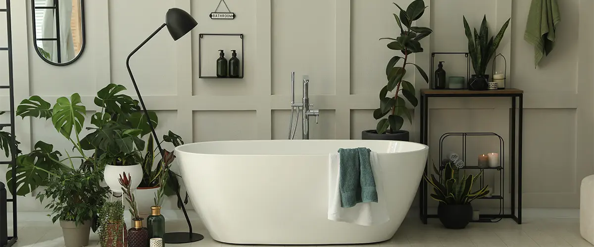 A freestanding tub with a lot of plants