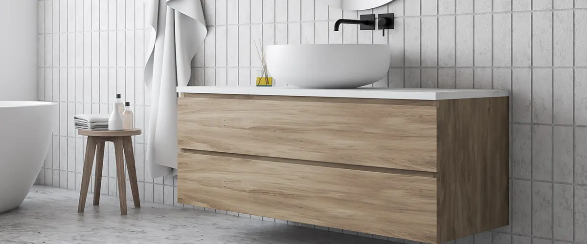 A modern wood vanity with a vessel sink