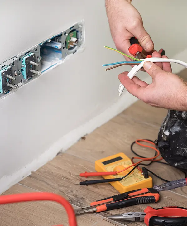cutting wires to install electrical wiring in PA