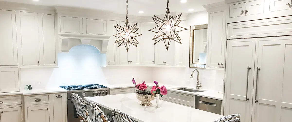 kitchen designed in pa with white cabinets and star-shaped fixtures
