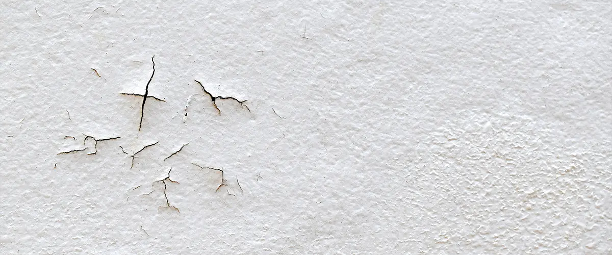 Cracked white paint on a wall
