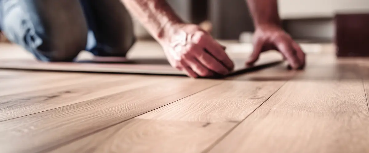 Man Installing Vinyl Plank Flooring In Springfield Pa