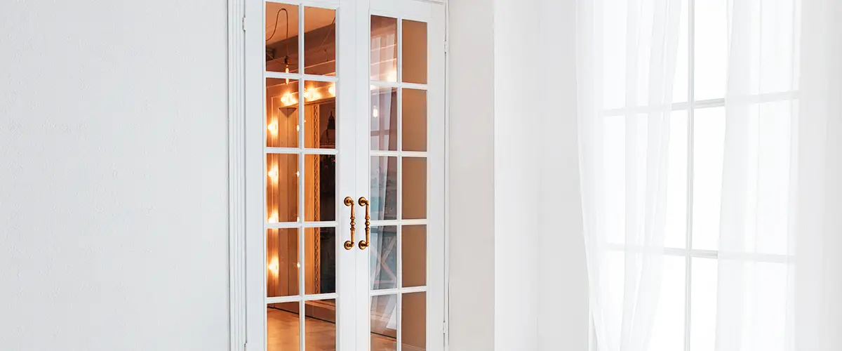 Empty white room with big window and glass french door
