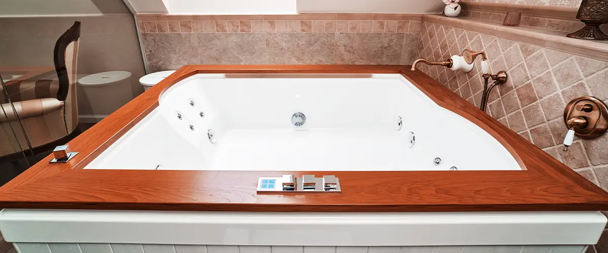 whirlpool bathtub installed in Pennsylvania with wood edges