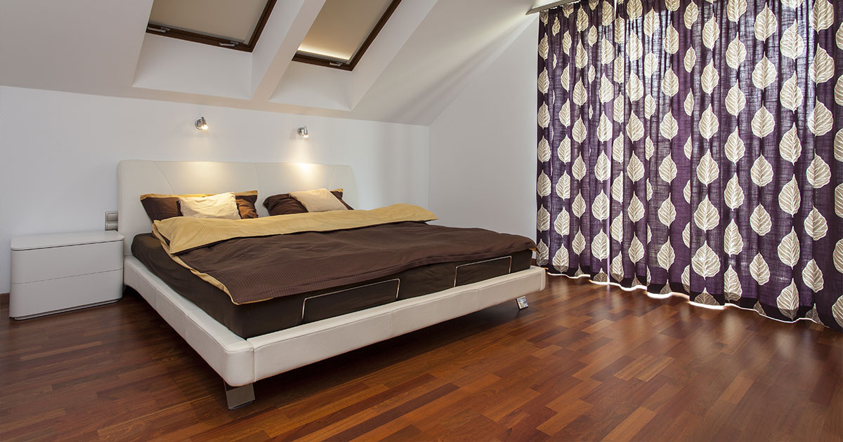 Elegant bedroom with walnut flooring, showcasing design pros and cons