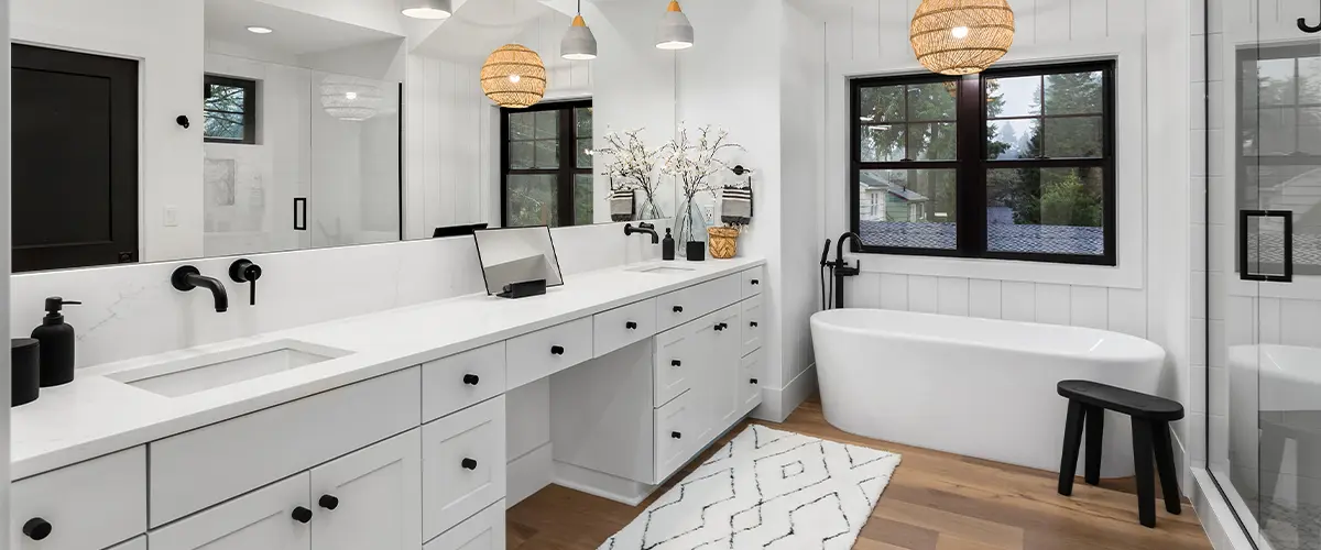 Luxurious bathroom remodeling in devon, with double vanity, freestanding tub, walk-in shower, and stylish lighting, perfect for modern home improvements.