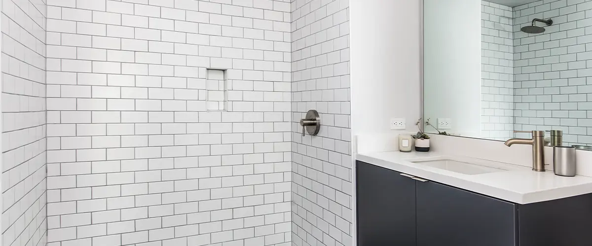 Modern bathroom with white subway tiles and hexagonal floor tiles