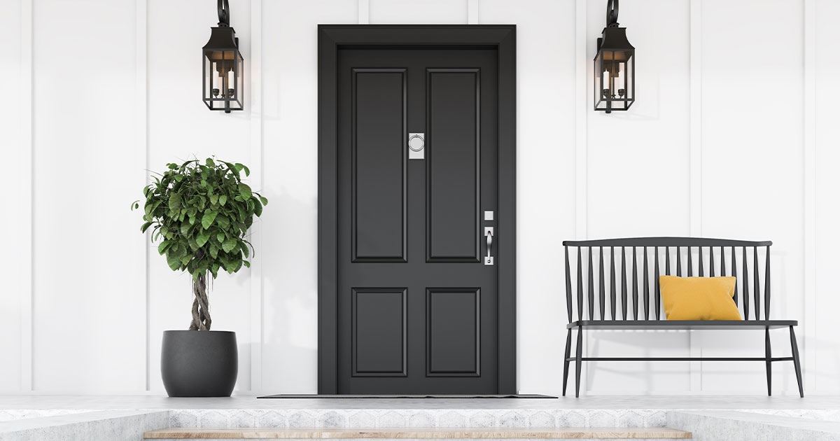 Stylish-front-porch-featuring-a-black-door,-matching-bench-with-a-yellow-pillow,-and-a-decorative-potted-plant