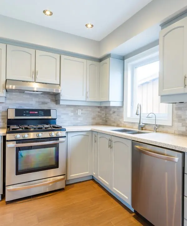 White kitchen cabinet and marble countertop