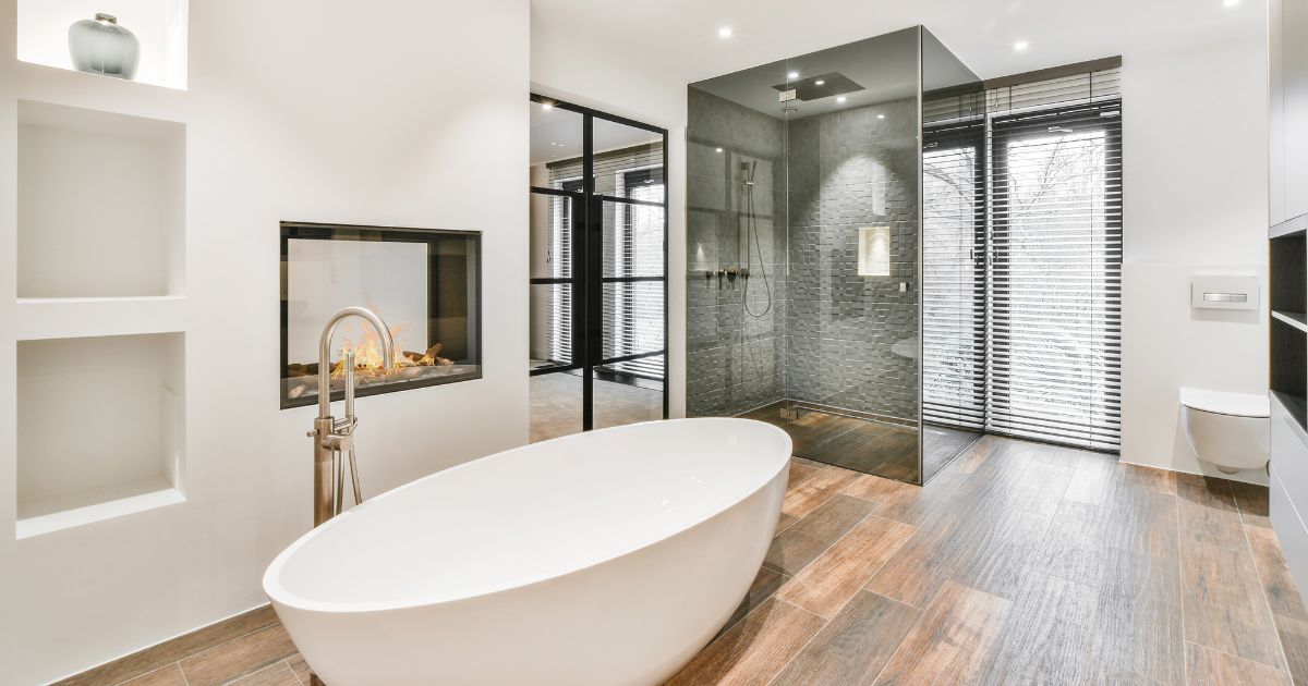 Elegant bathroom remodel featuring a glass shower, modern fixtures, and a soaking tub